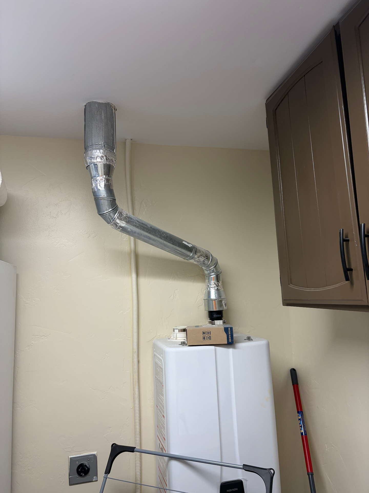 Tankless venting — clean routing to roof