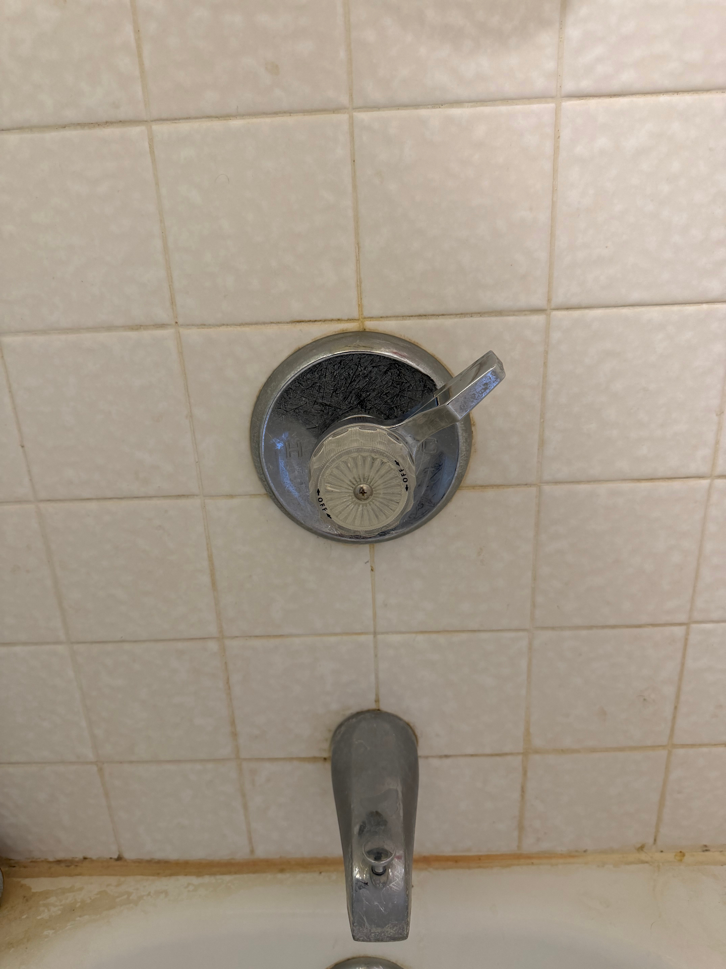 Old single-handle tub/shower — pre-replacement