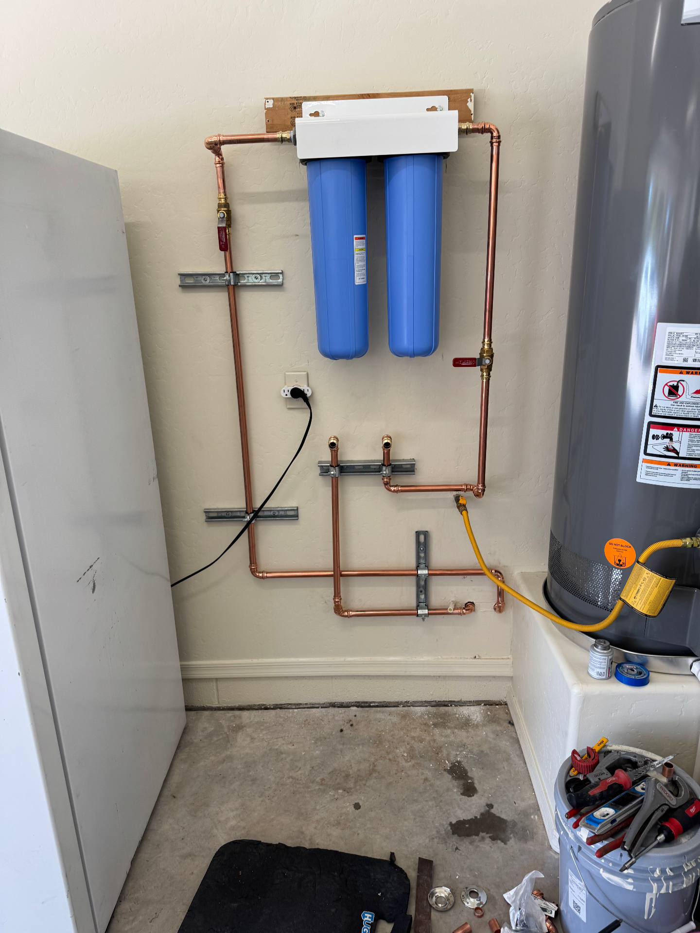 Whole-home water filter with copper repipe